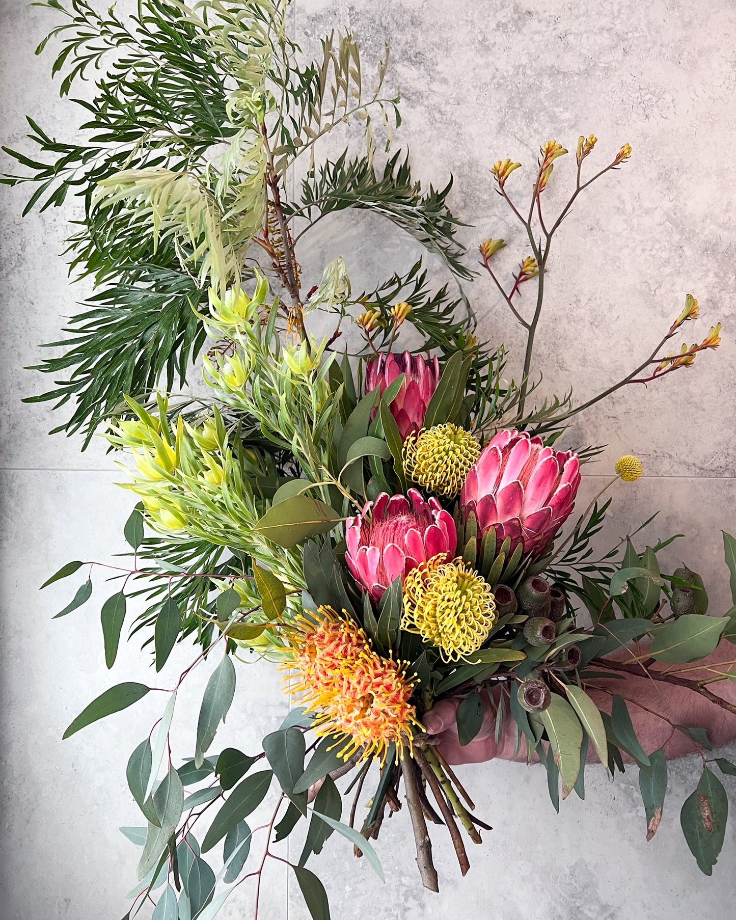 A showstopping, hand-tied bouquet of native flowers including protea, kangaroo paw, grevillea and seasonal blooms, delivered fresh across Melton by The Flowered Heart