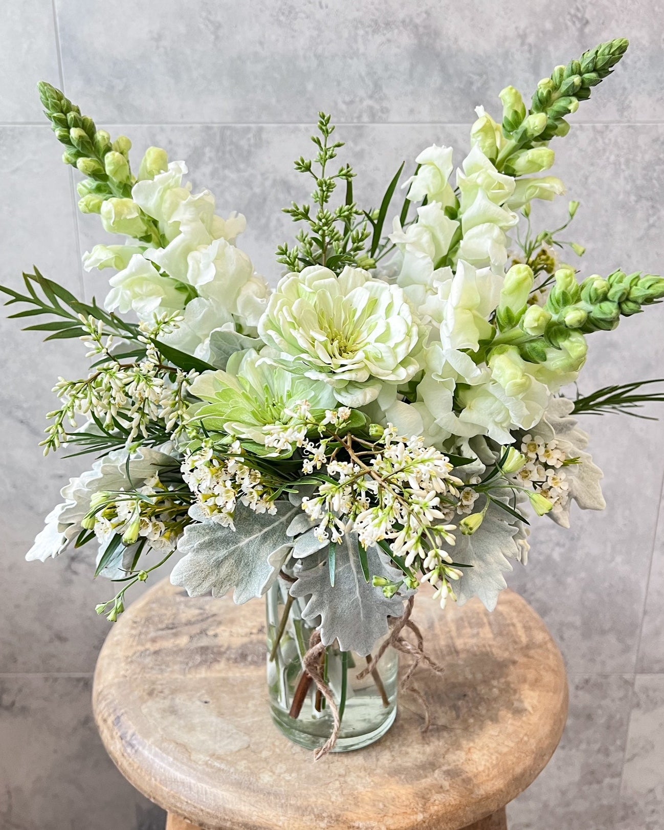 A elegant, jar arrangement of fresh flowers including zinnia, snapdragon and seasonal blooms, available for same day flower delivery in Melton and surrounding areas by The Flowered Heart