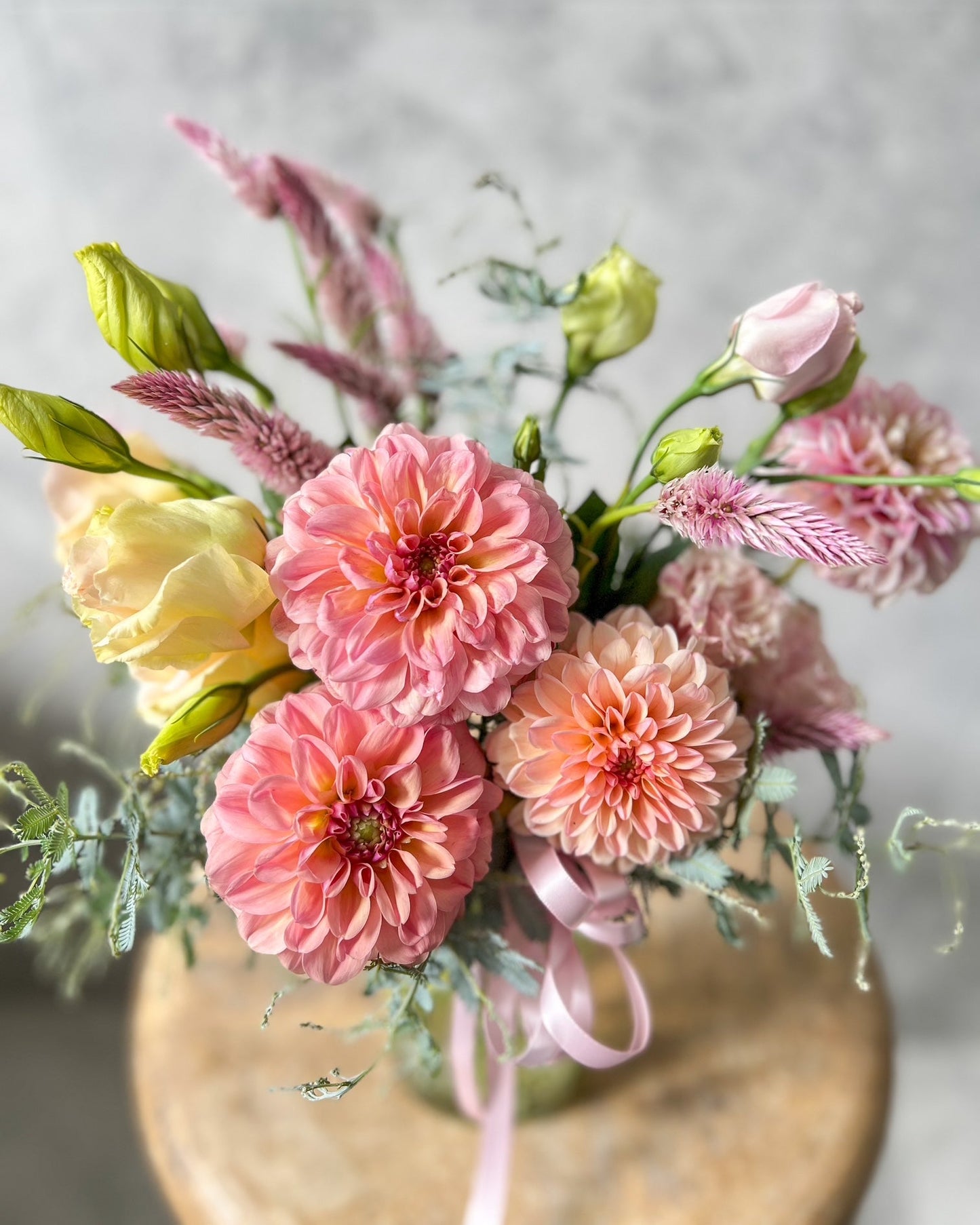 A colourful jar arrangement of fresh flowers including dahlia, lisianthus and seasonal blooms, available for same day flower delivery in Melton and surrounding areas by The Flowered Heart