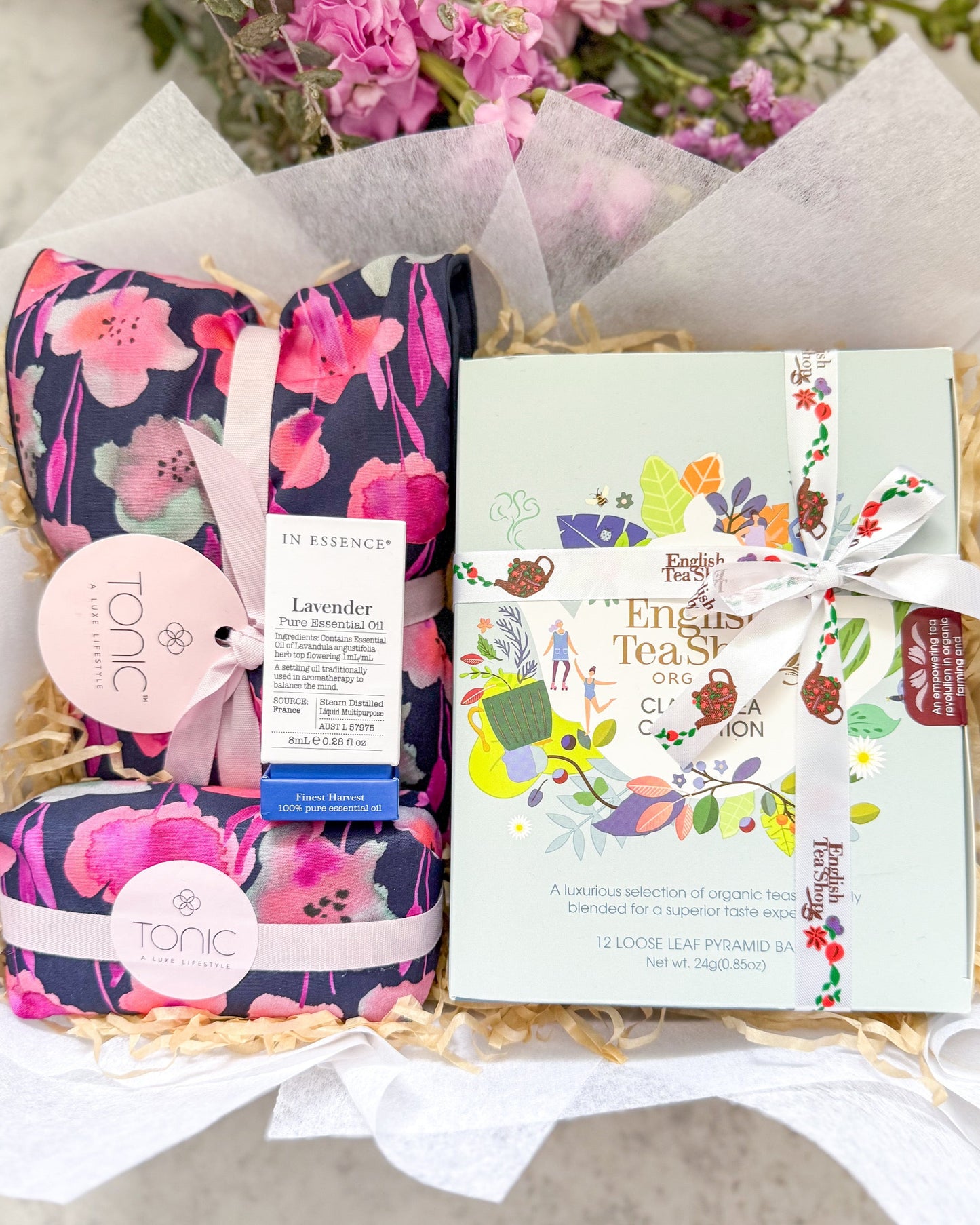Gentle Hug Gift Hamper includes, Tonic Heat Pillow and Soap Bar, In Essence Pure Essential Oil and an Organic tea assortment form th English Tea Shop.