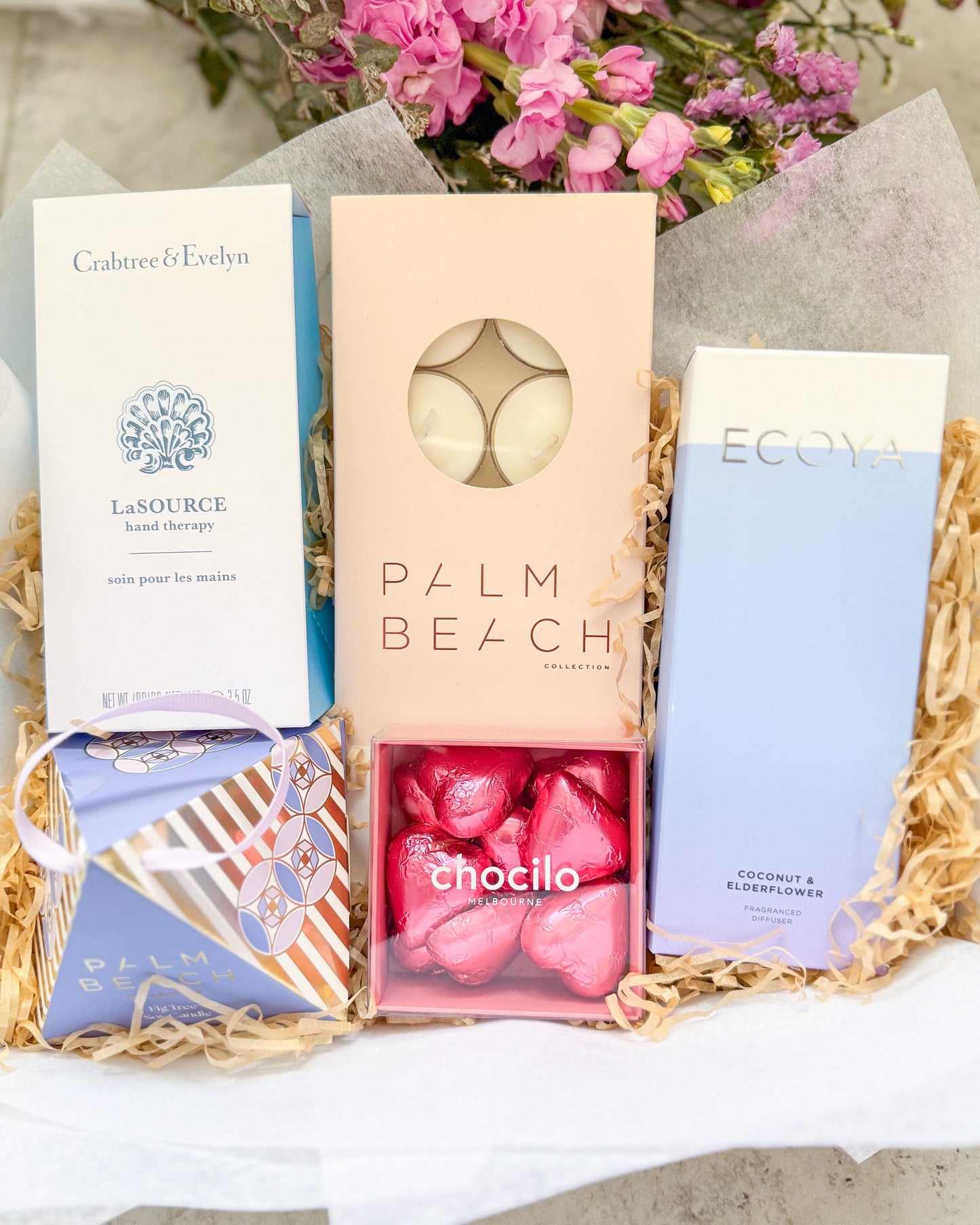 Hello Lovely Gift Hamper includes a soothing assortment of fragranced candles, diffusers, hand cream and chocolates. A lovely gift for someone special.