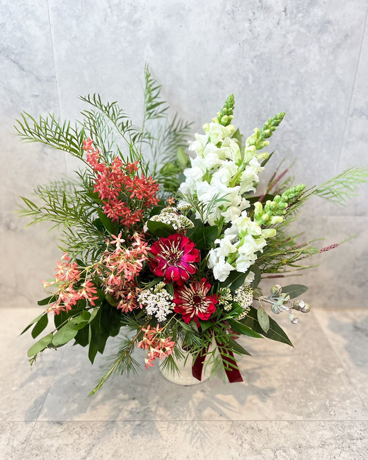 A christmas jar arrangement of fresh flowers including zinnia, snapdragon and seasonal blooms, available  for same day flower delivery in Melton and surrounding areas by The Flowered Heart