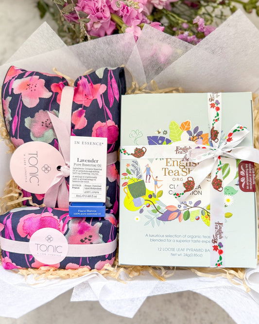 Gentle Hug Gift Hamper includes, Tonic Heat Pillow and Soap Bar, In Essence Pure Essential Oil and an Organic tea assortment form th English Tea Shop.