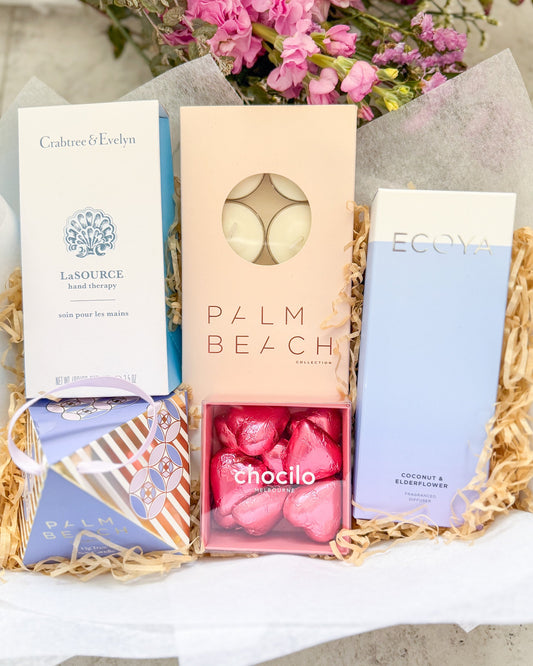 Hello Lovely Gift Hamper includes a soothing assortment of fragranced candles, diffusers, hand cream and chocolates. A lovely gift for someone special.