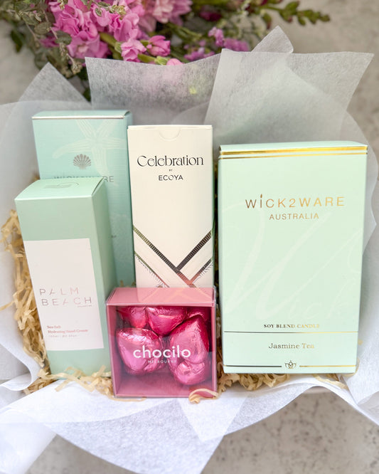 Moments of Calm Gift Hamper includes soothing Jasmine Tea candle from Wick 2 Ware and other fragrant gifts. Also includes Chocilo Chocolate hearts and Palm Beach Hand Cream.